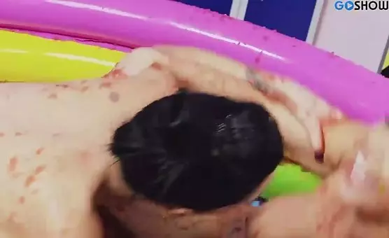 Happy Lesbians Enjoying Red Mud Playtime in Inflatable Pool